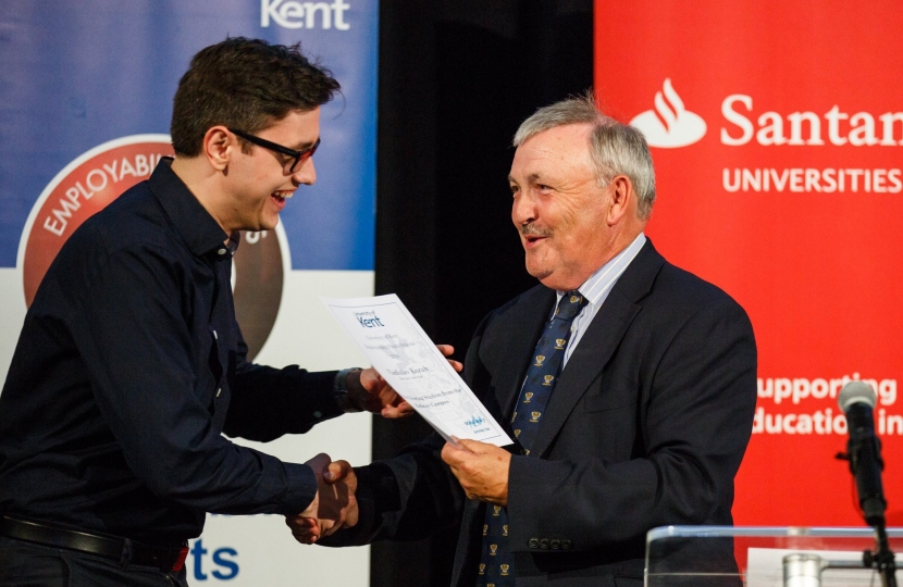 Alan Jarrett presenting a student with his reward