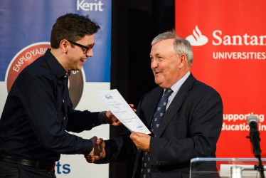 Alan Jarrett presenting a student with his reward