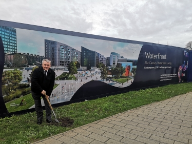 Alan Jarrett with a shovel at the ground breaking